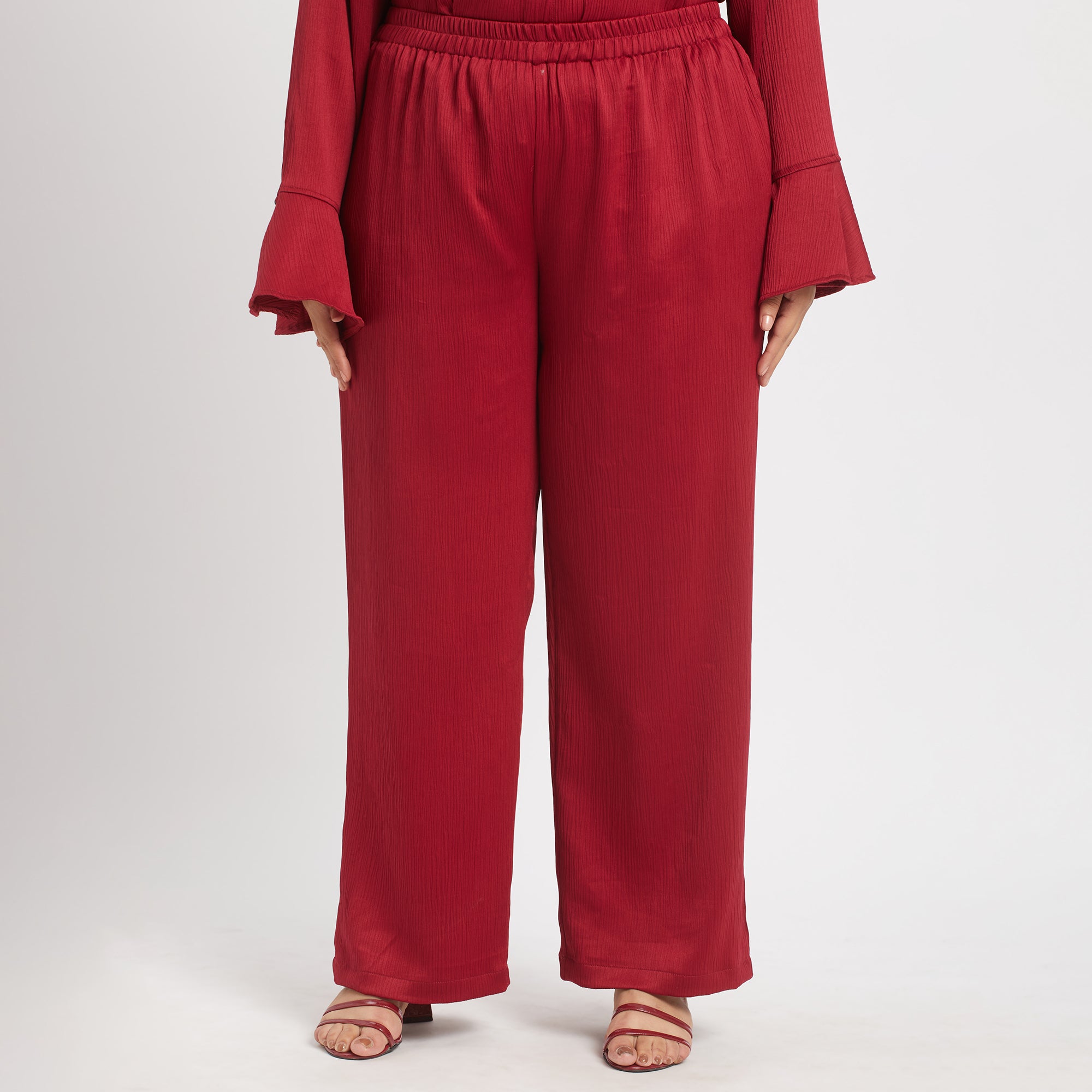 Image showcasing pants of red satin co-ord set