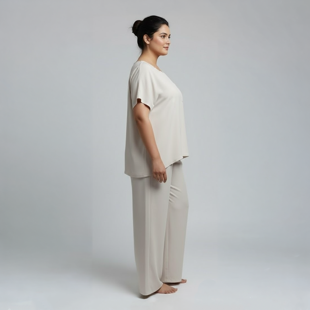 Plus size model in beige lounge set with wide leg pants
