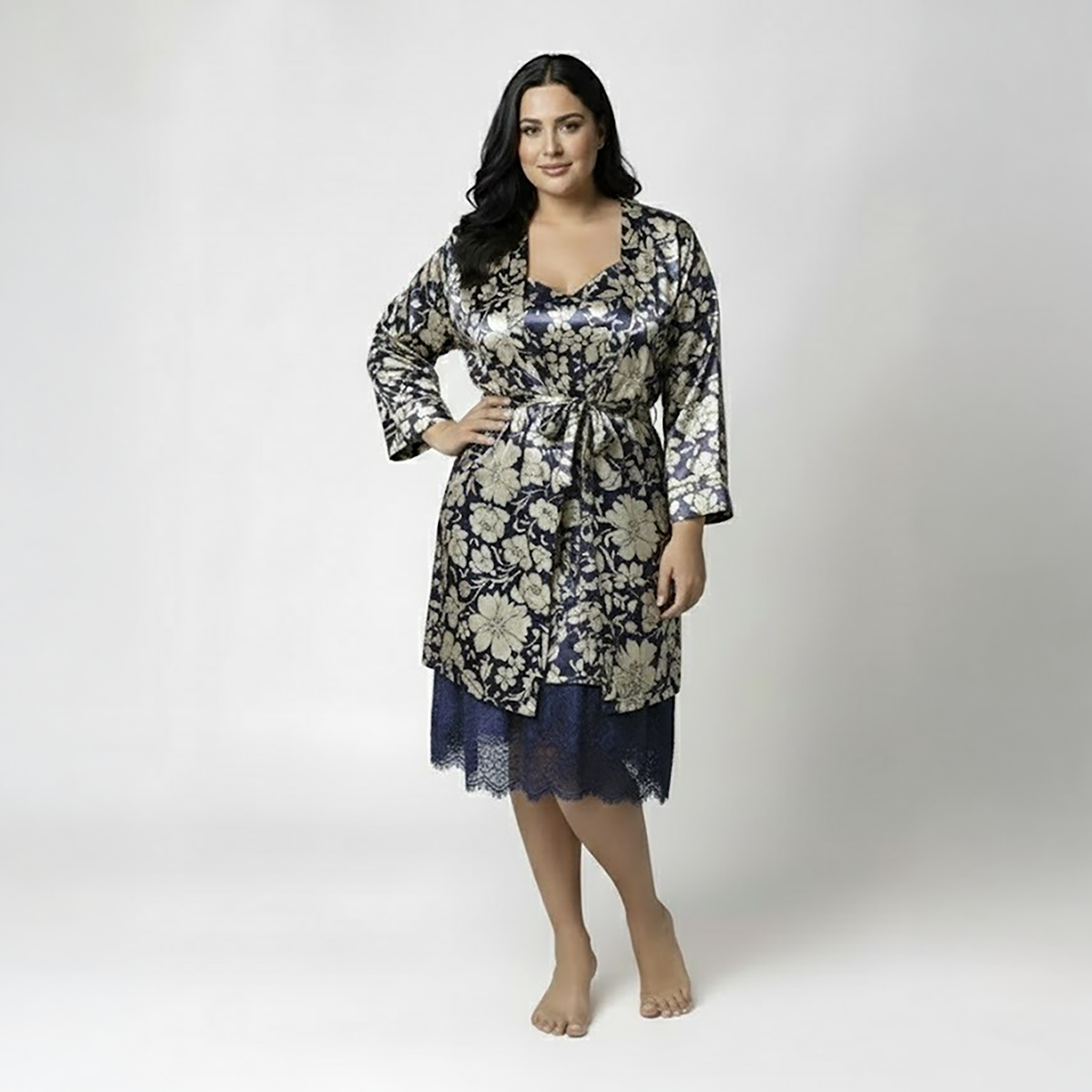 Woman wearing blue satin nightdress with matching robe set