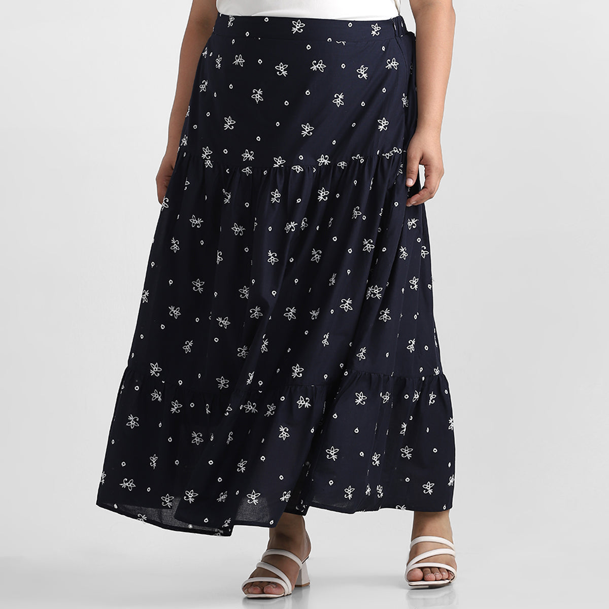 Plus size model wearing cotton schiffli summer skirt