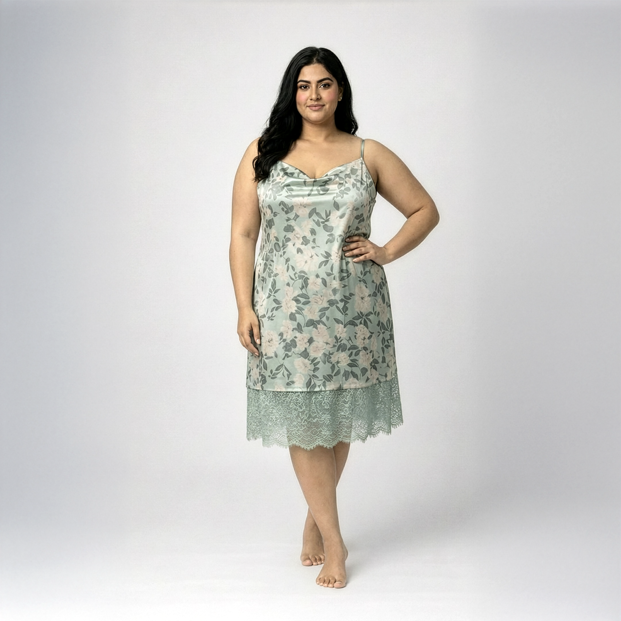 Plus size woman wearing light green satin nightdress