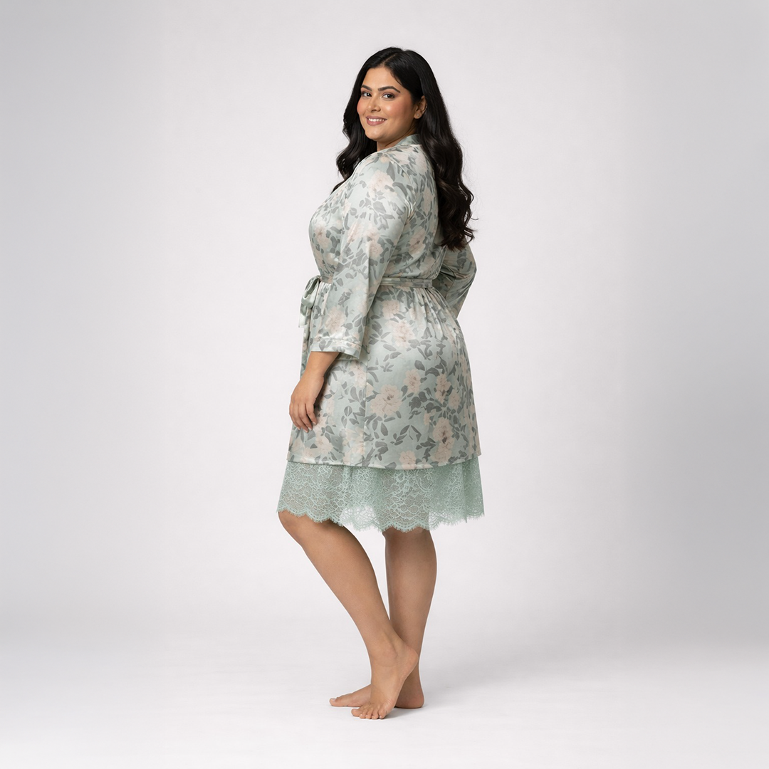 Woman wearing a green floral nightgown on a white background