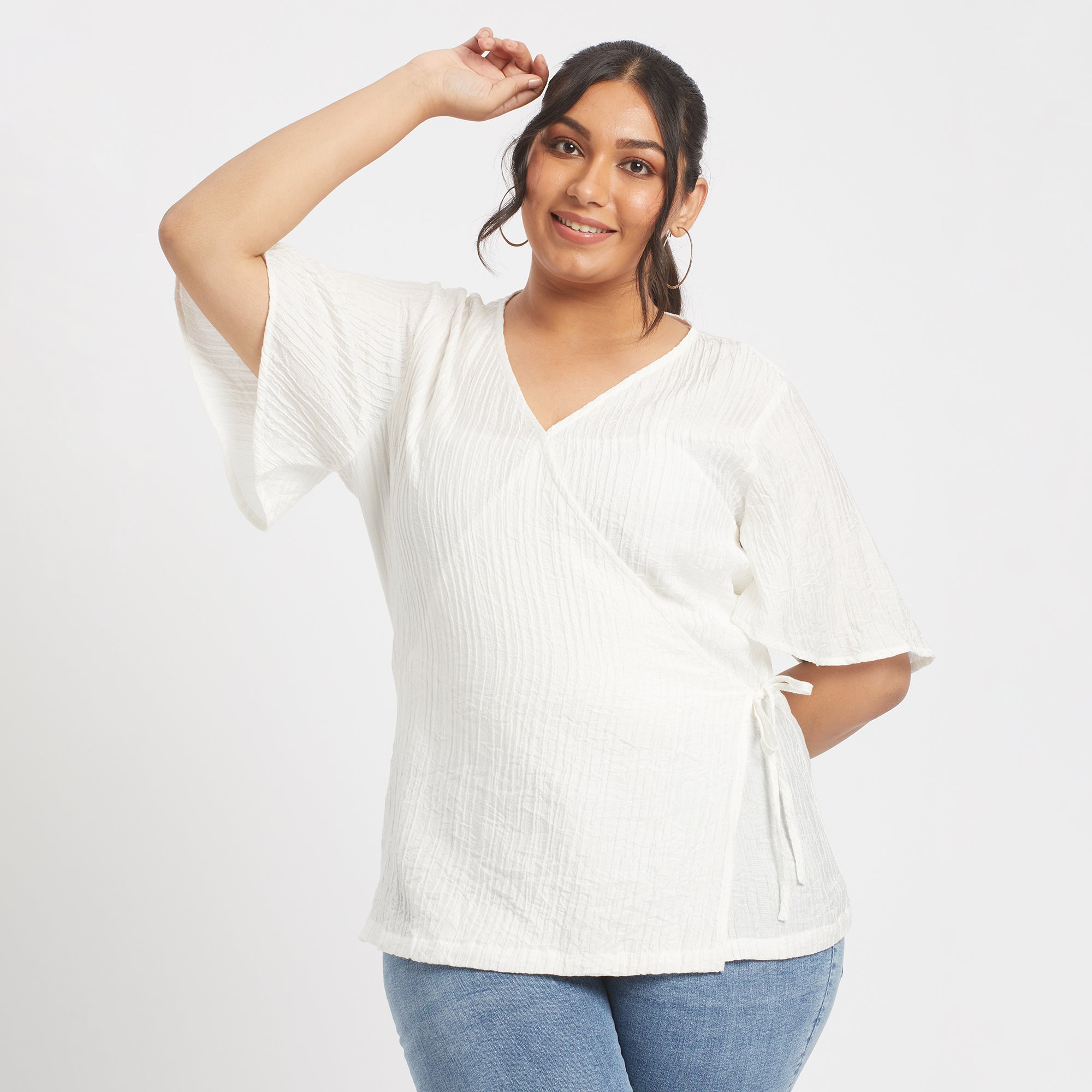 Front view of white viscose nylon plus size wrap top