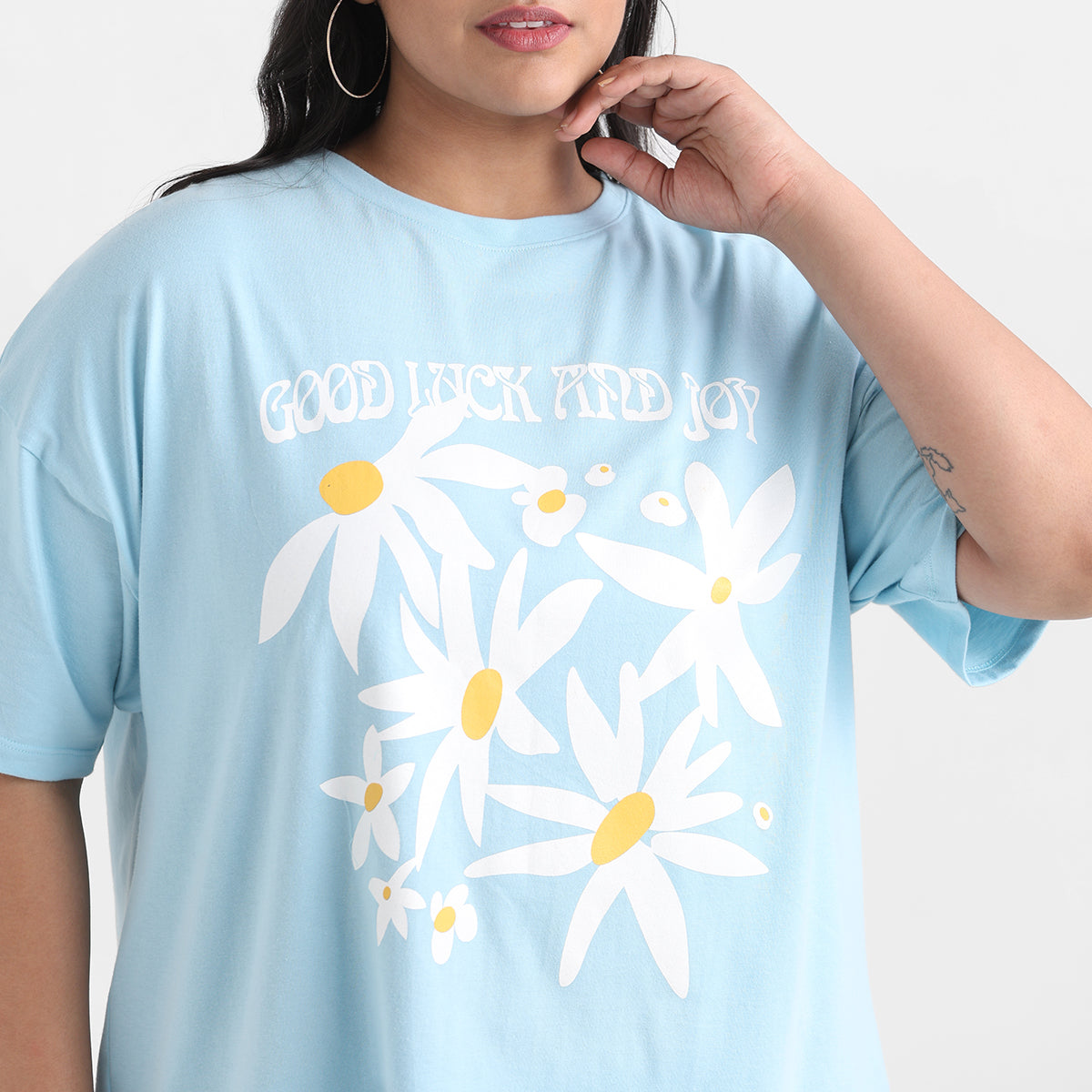Light floral print tshirt with drop shoulders and comfortable, plus-size fit.
