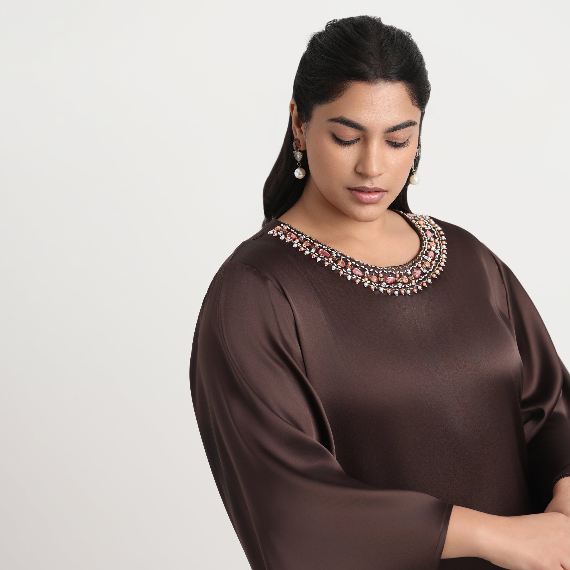Elegant brown satin dress with a soft shine, tailored for a plus-size fit.
