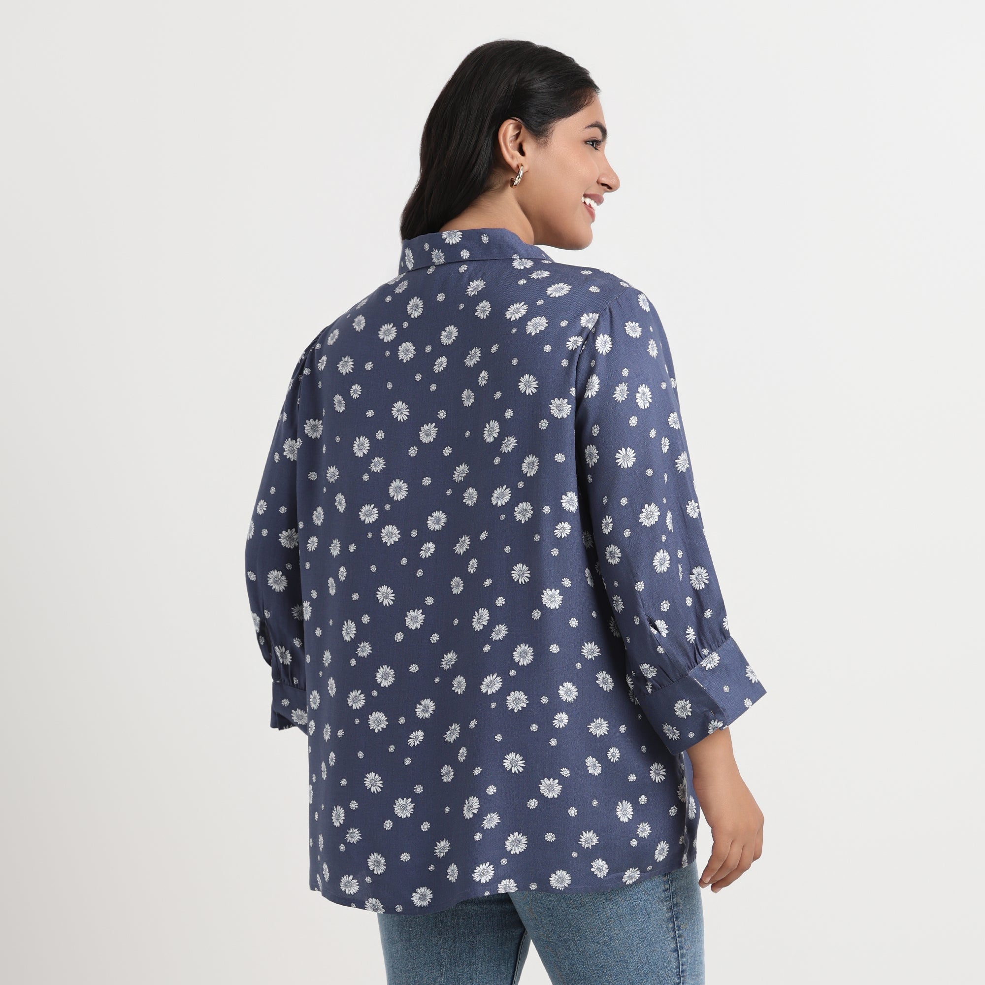 Daisy print shirt with a soft pastel design and a comfortable, relaxed fit.