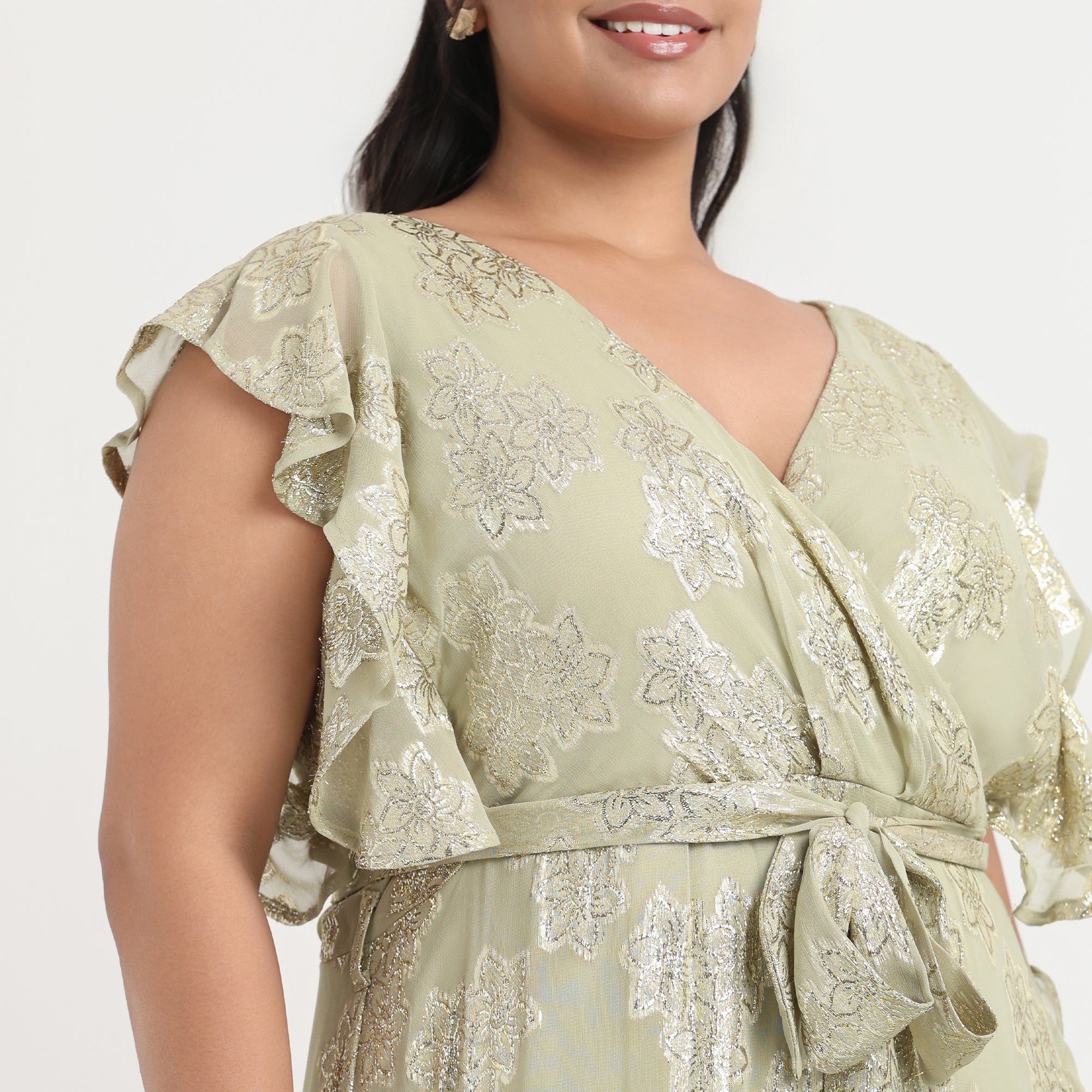 Green lurex burnout ruffled dress with a shimmer effect and a feminine, flowy fit.
