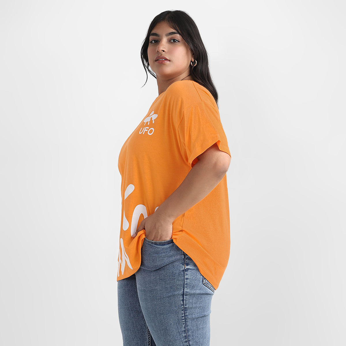 Orange t-shirt with graphic print, drop shoulders, and plus-size fit.
