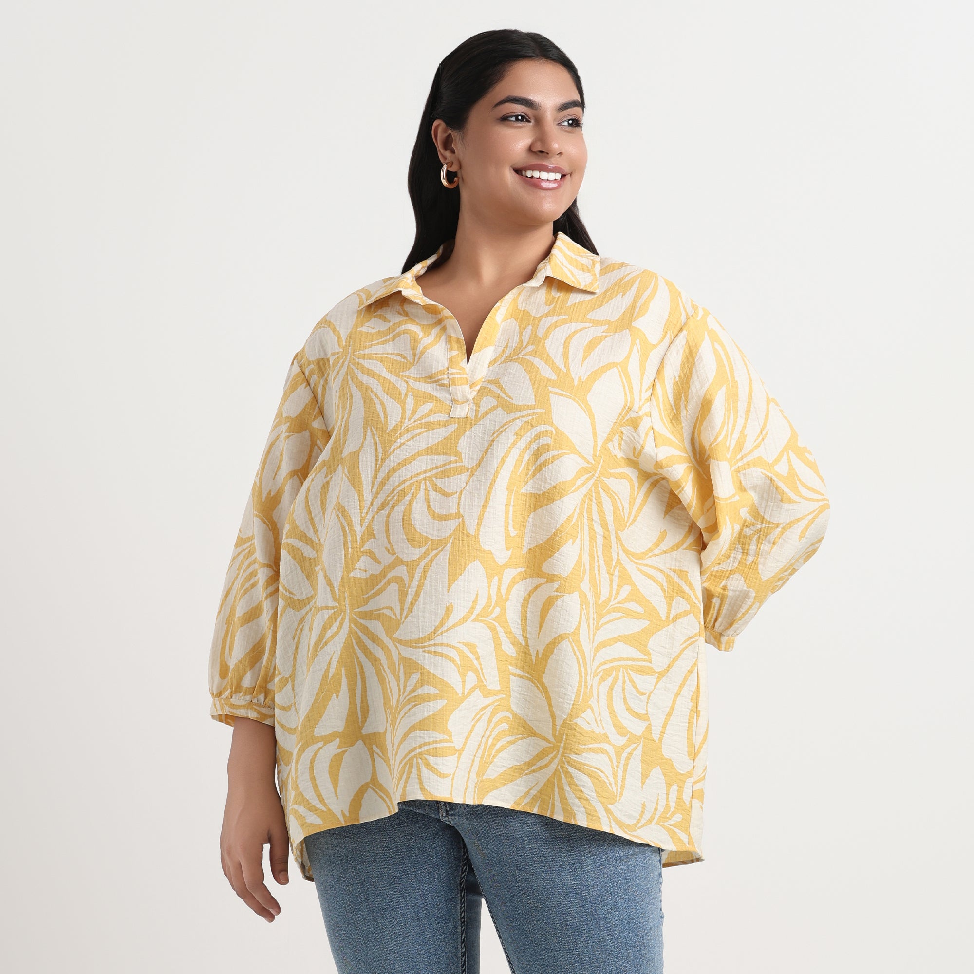 Yellow printed shirt with intricate designs and comfortable, long sleeves.
