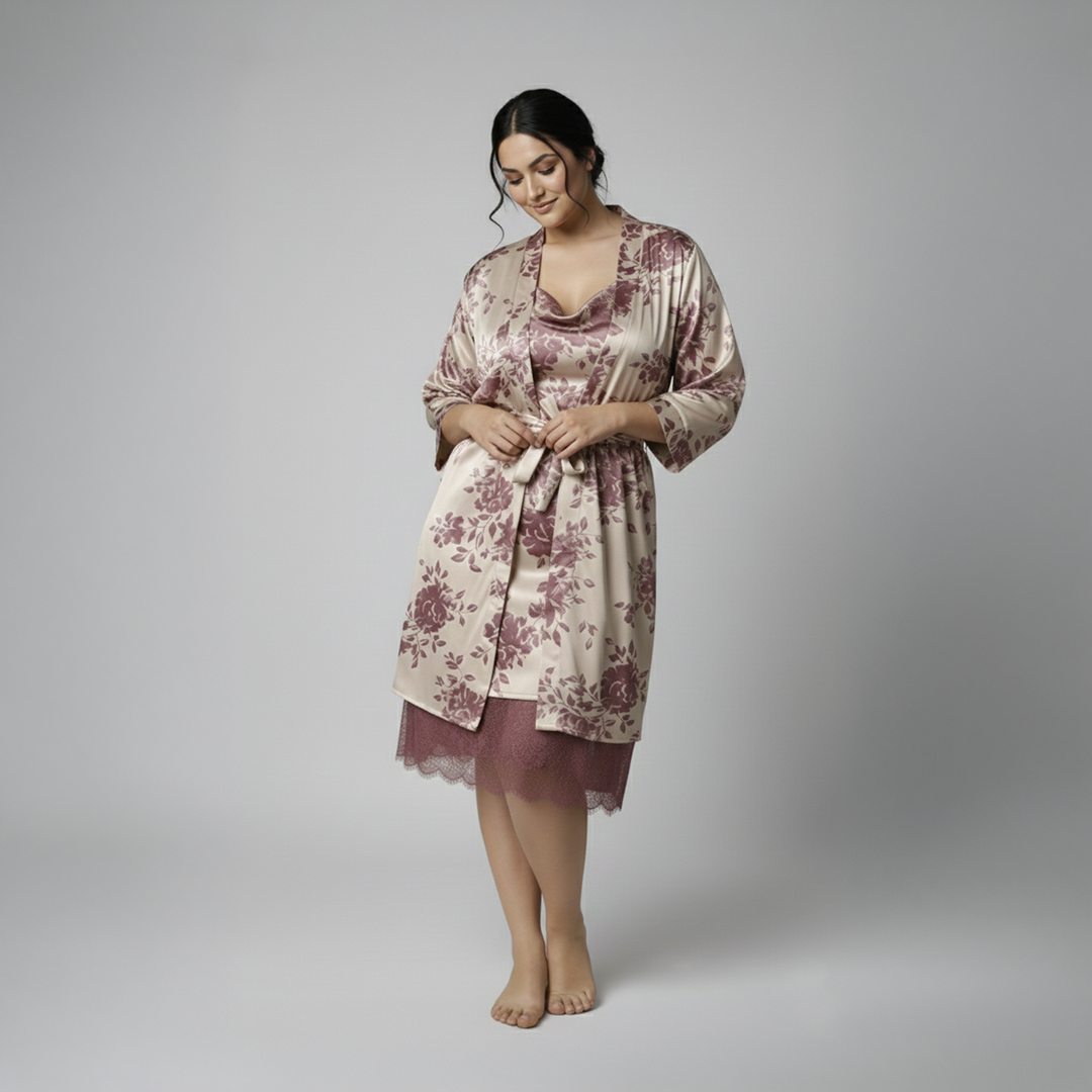 Woman wearing a floral robe and nightgown set on a plain background
