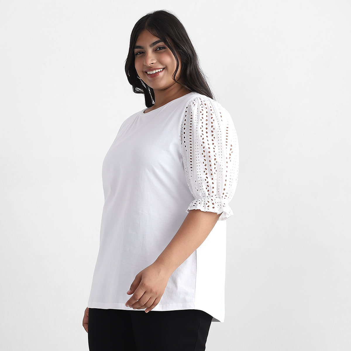 Image showcasing side profile of women in white top